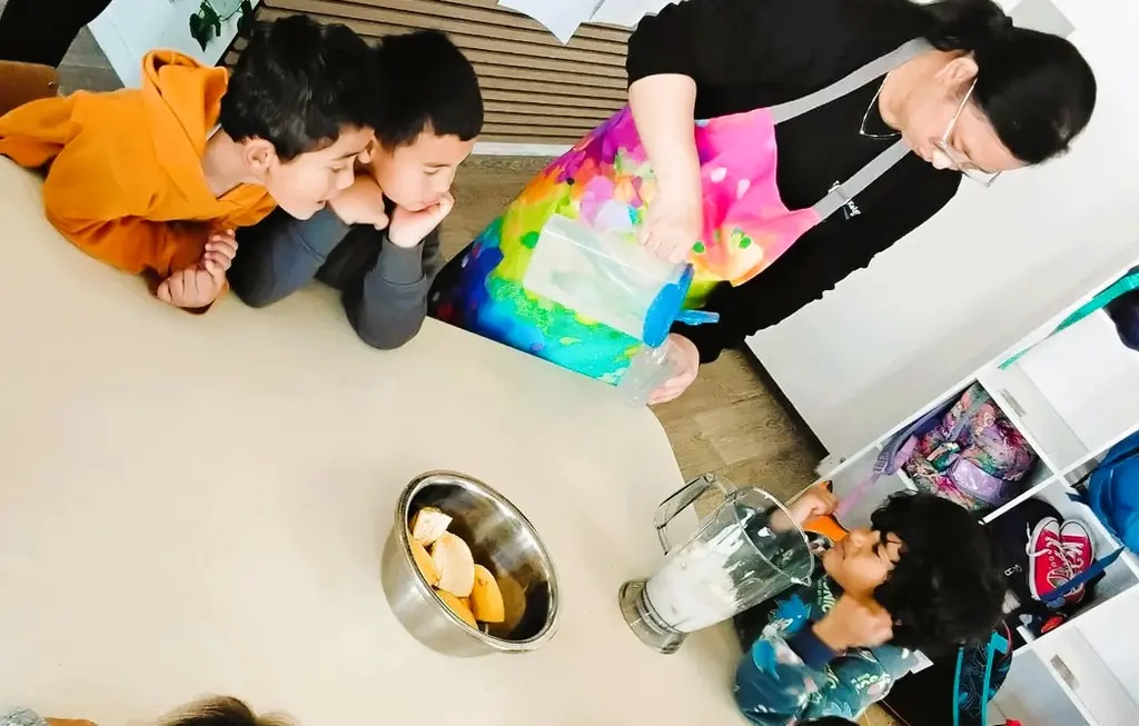 Kaiako and tamariki preparing ingredients together at a table