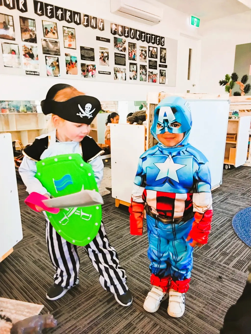 Children dressed as a superhero and a pirate